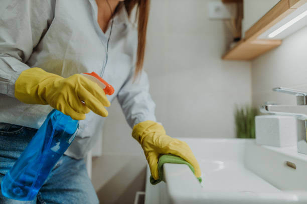 Why Abu Dhabi’s Climate Demands Regular Deep Cleaning maid cleaning wash Basin